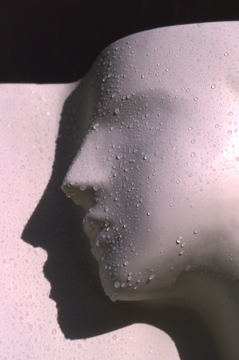 Sculpture of head with raindrops